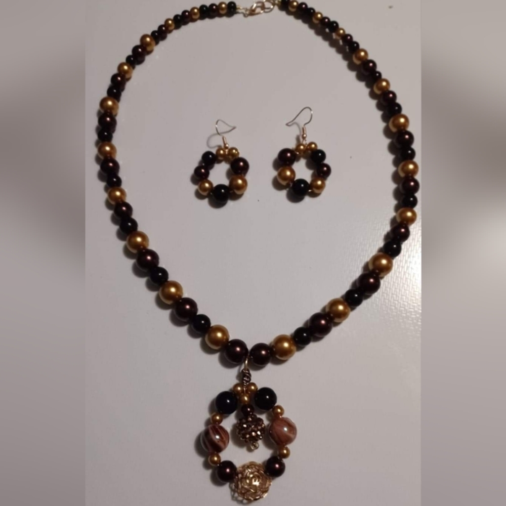 Hand crafted black and gold necklace and earring set.